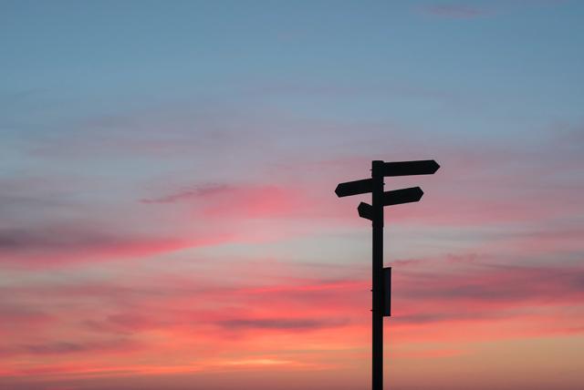 A roadsign in the sunset